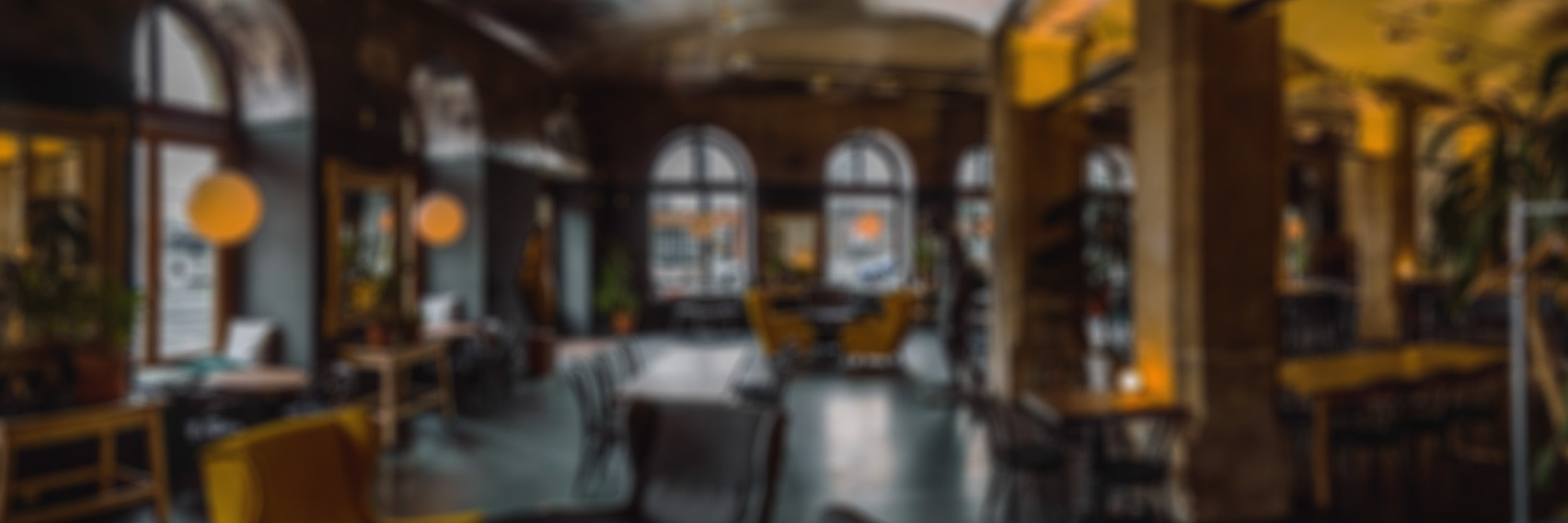 Wide out of focus image of a coffee shop lobby.