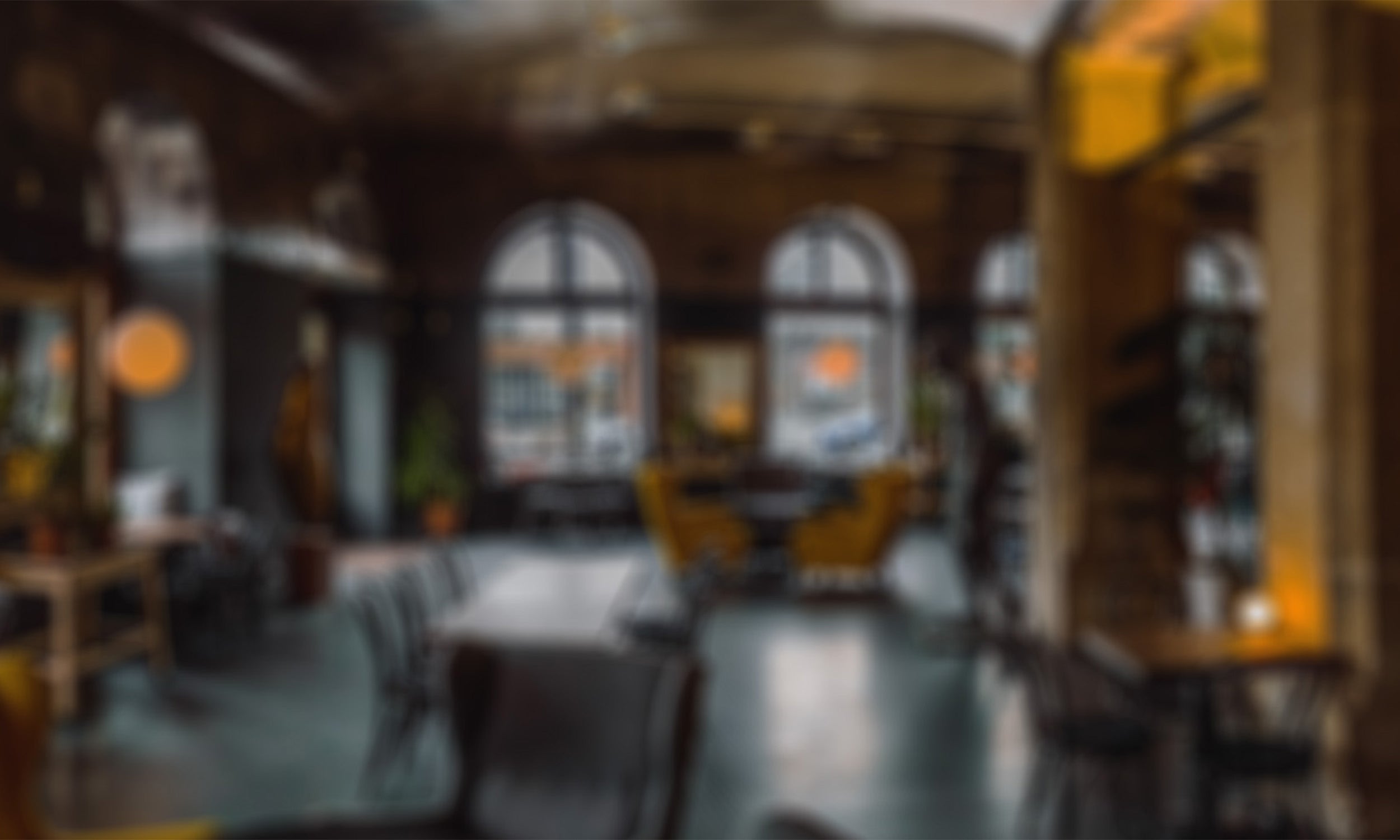 Image of an out of focus coffee shop lobby.